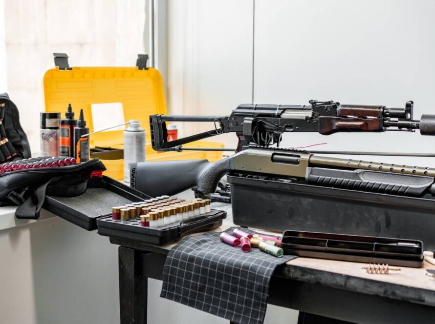 A firearm being cleaned with essential gun maintenance tools.